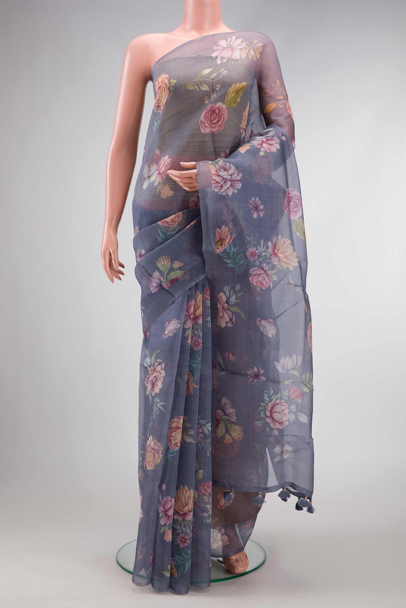 Grey Dual Tone Organza Silk Saree with Printed design on the body and Without Border.  displayed on a mannequin
