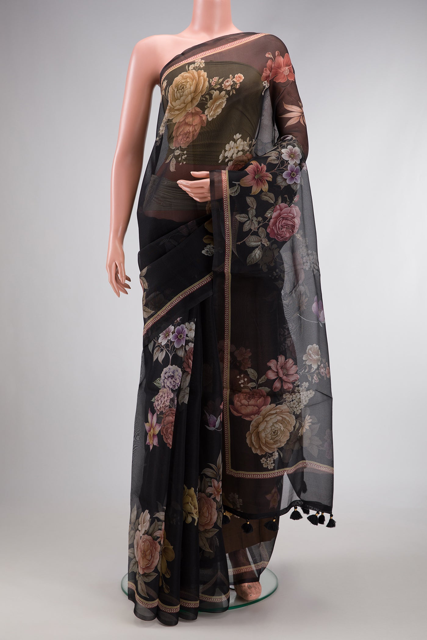 Black Dual Tone Organza Silk Saree with Printed design on the body and Printed Border.  displayed on a mannequin