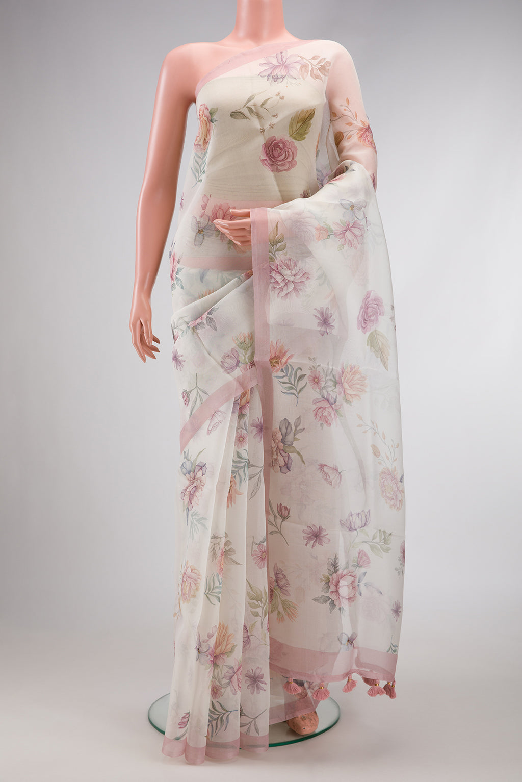Off White Dual Tone Organza Silk Saree with Printed design on the body and Plain Border.  displayed on a mannequin