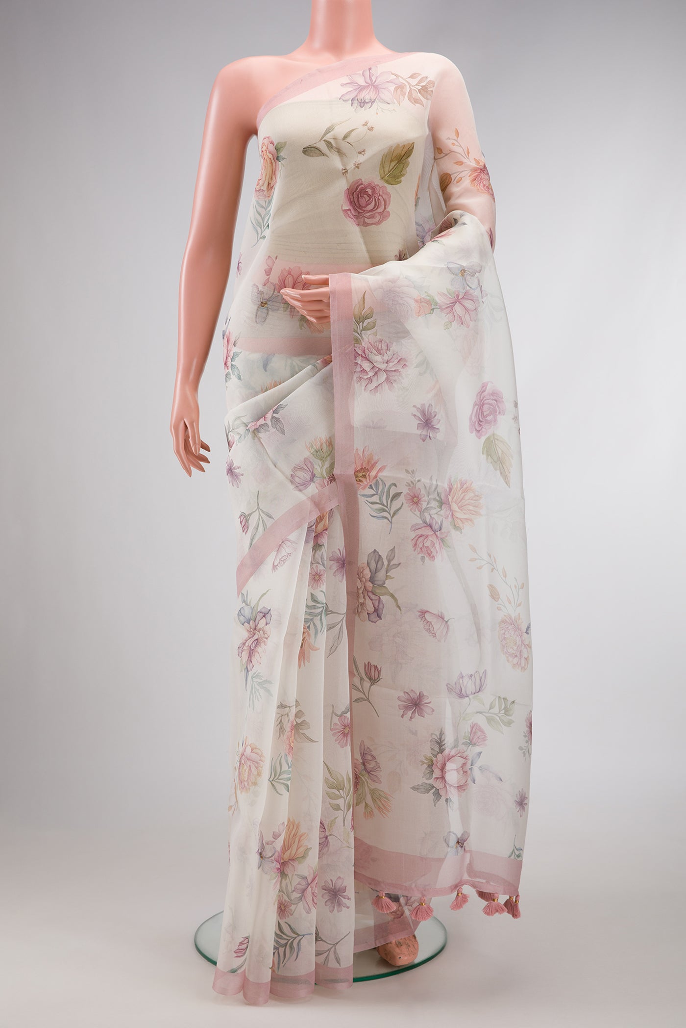 Off White Dual Tone Organza Silk Saree with Printed design on the body and Plain Border.  displayed on a mannequin