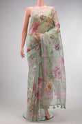 Pista Green Dual Tone Organza Silk Saree with Printed design on the body and Printed Border.  displayed on a mannequin