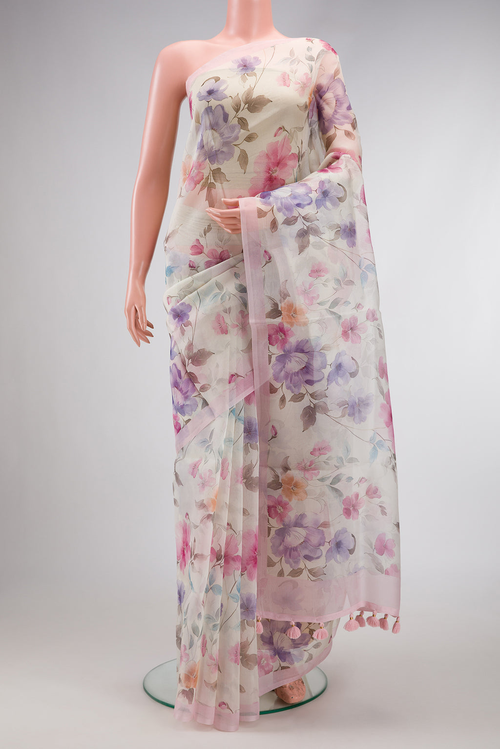 Off White Dual Tone Organza Silk Saree with Printed design on the body and Plain Border.  displayed on a mannequin