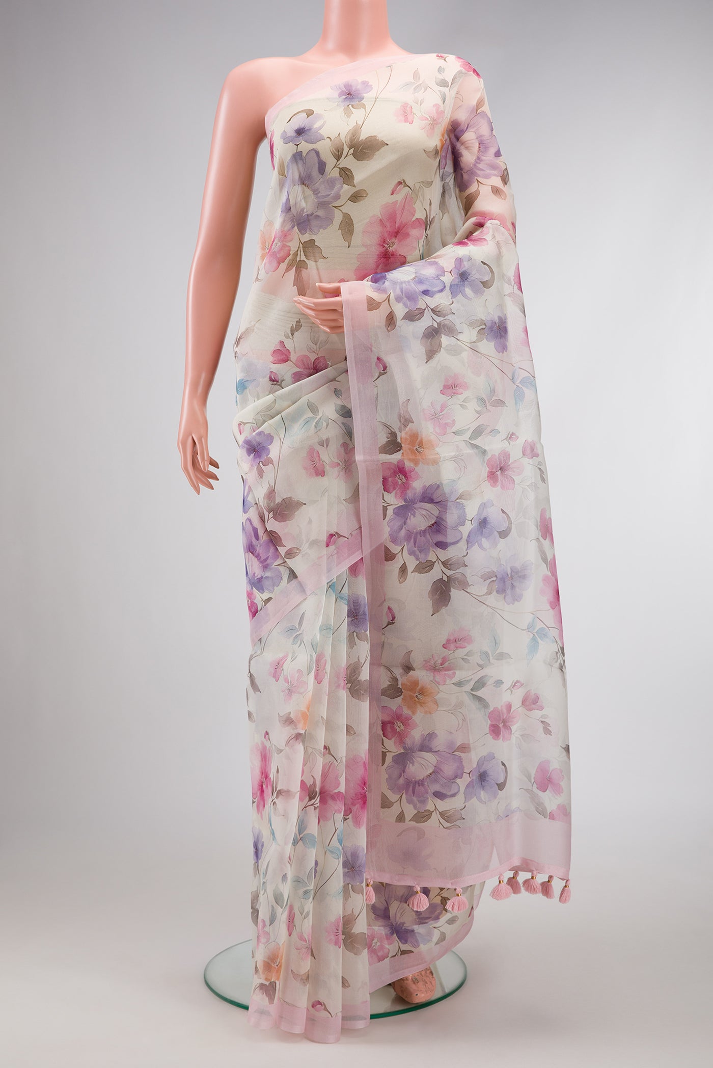 Off White Dual Tone Organza Silk Saree with Printed design on the body and Plain Border.  displayed on a mannequin