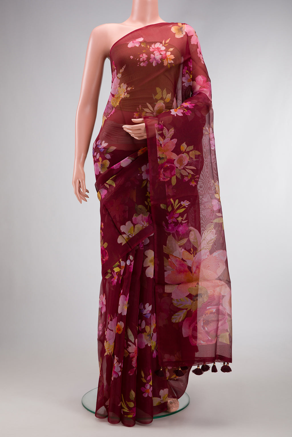 Maroon Dual Tone Organza Silk Saree with Printed design on the body and Without Border.  displayed on a mannequin