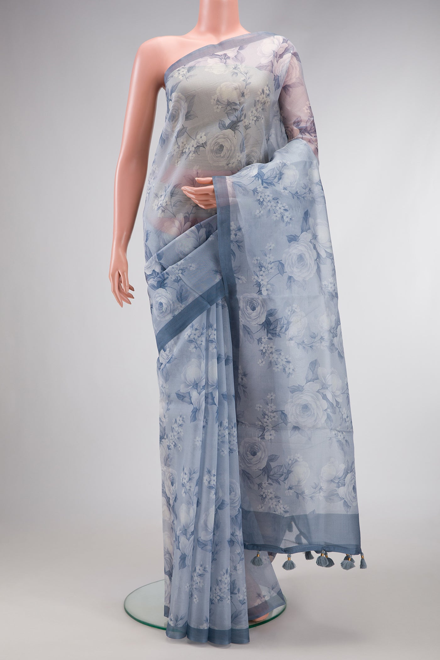 Grey Dual Tone Organza Silk Saree with Printed design on the body and Plain Border.  displayed on a mannequin
