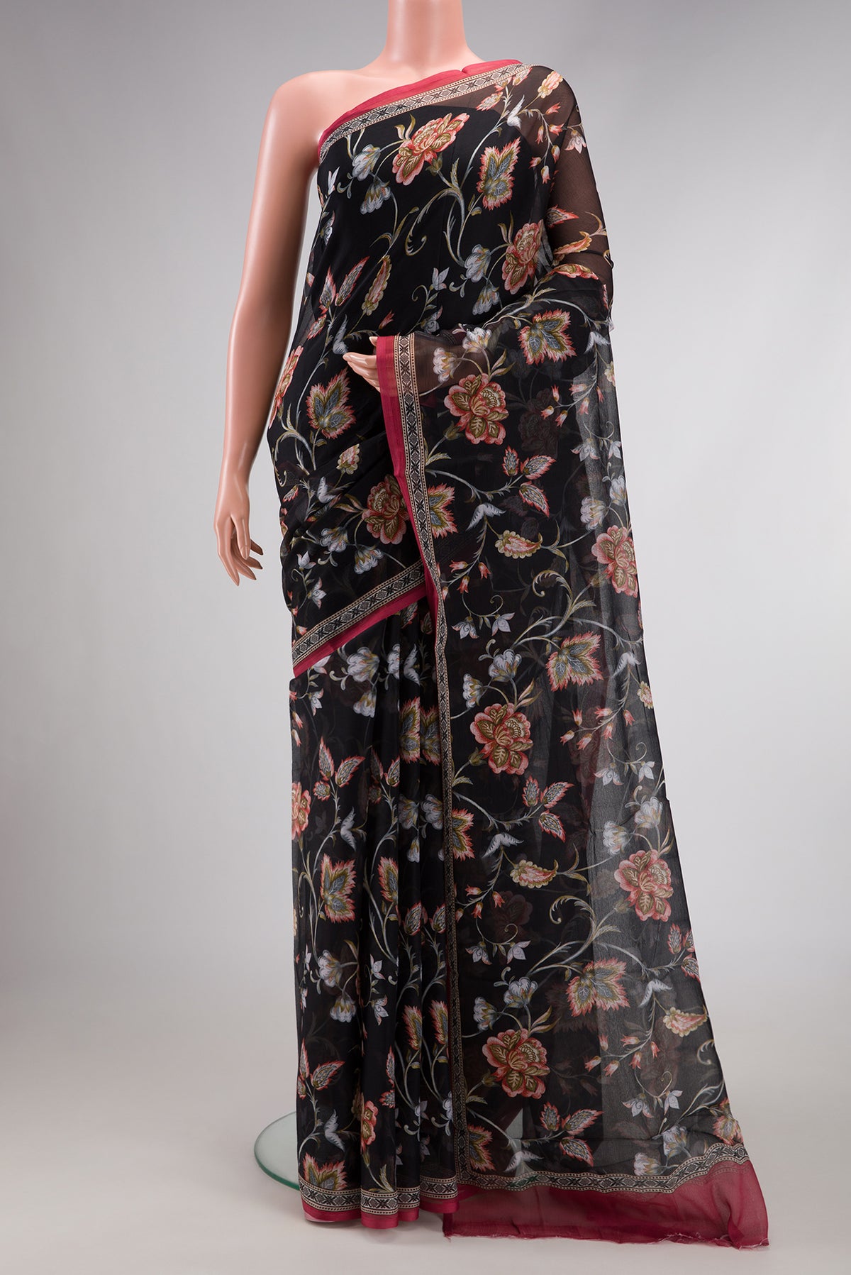 Black Dual Tone Mysore Chiffon Saree with Printed design on the body and Plain Border.  displayed on a mannequin