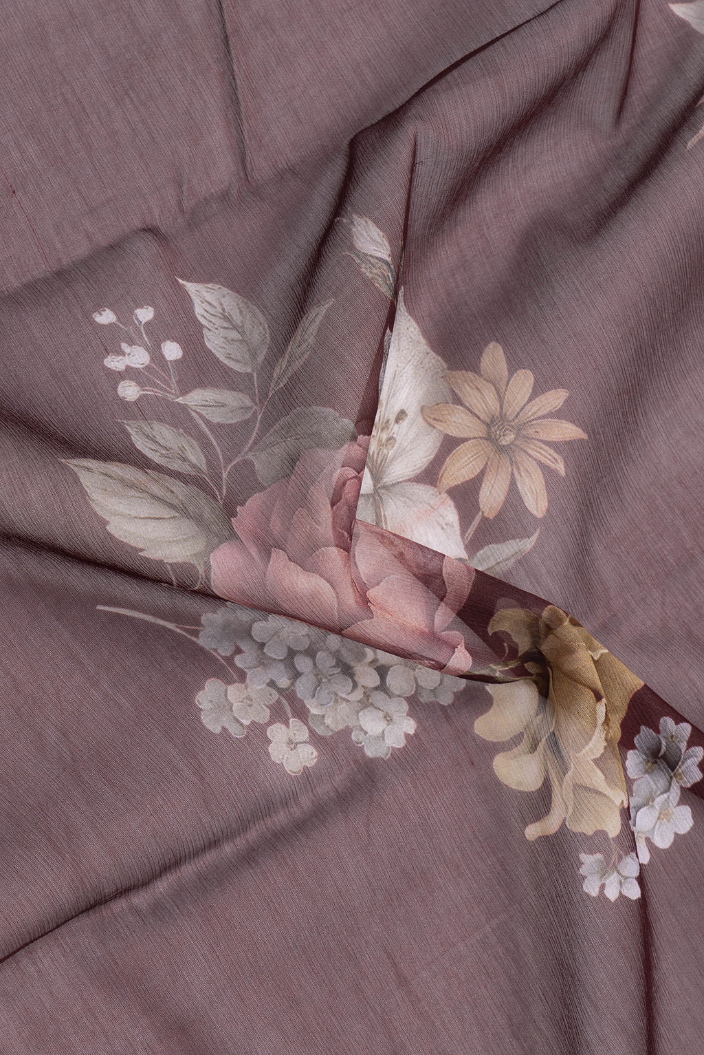 Close up of Coffee Brown Mysore Chiffon Saree with Printed design on the body and Printed Border.  displaying folds