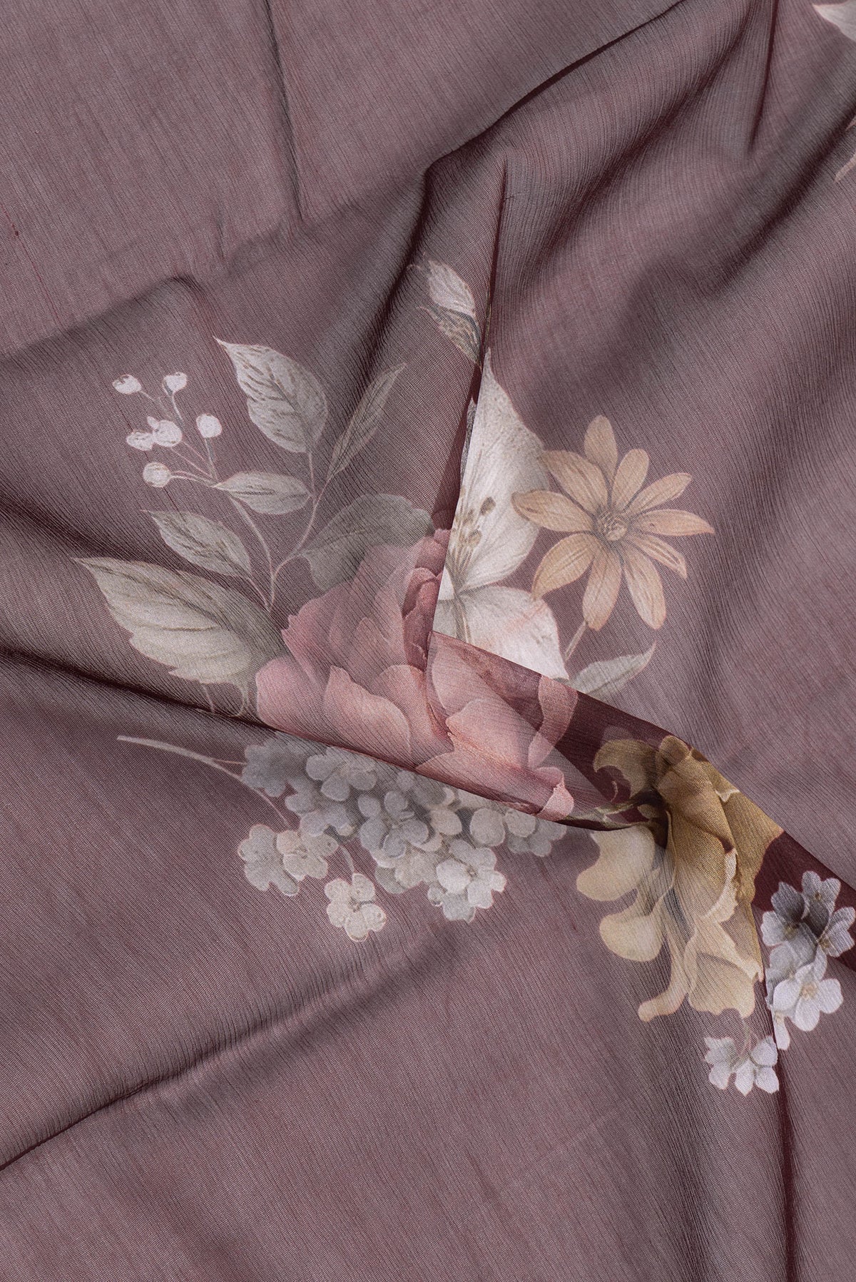 Close up of Coffee Brown Mysore Chiffon Saree with Printed design on the body and Printed Border.  displaying folds