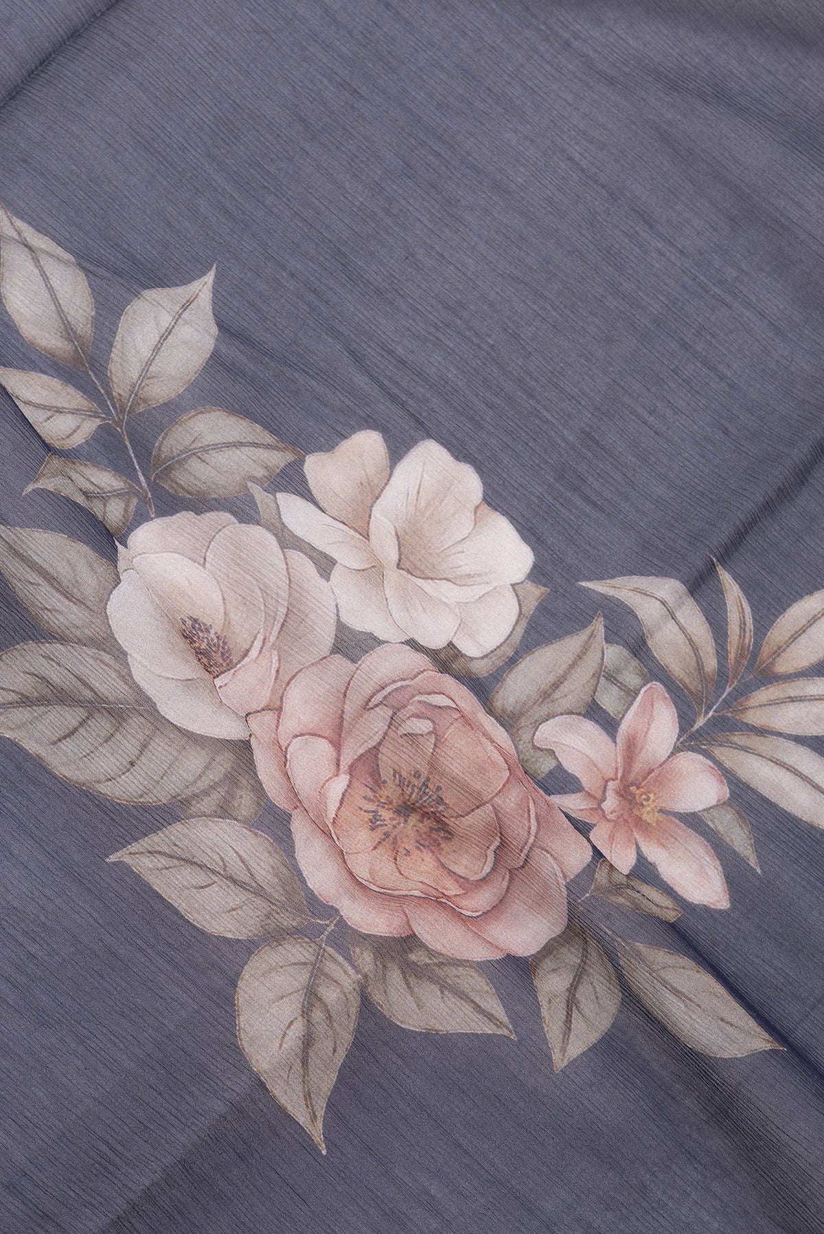 Close up of Navy Blue Mysore Chiffon Saree with Floral Print on the body and Plain Border.  displaying folds