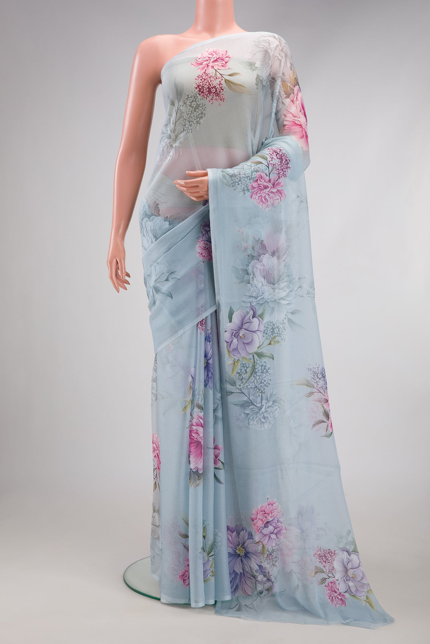 Light Blue Mysore Chiffon Saree with Floral Print on the body and Without Border.  displayed on a mannequin
