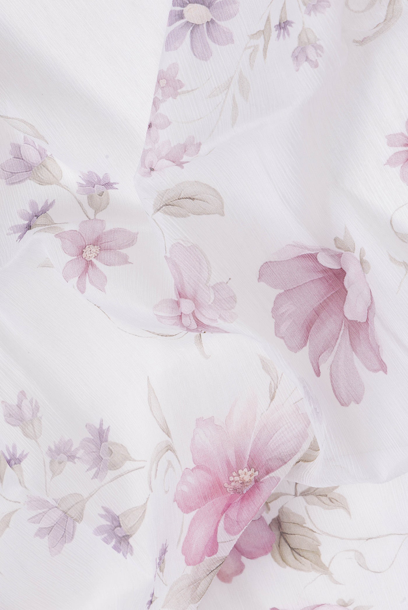 Close up of White Dual Tone Mysore Chiffon Saree with Printed design on the body and Plain Border.  displaying folds
