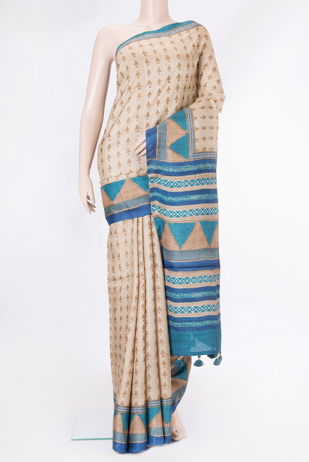 Beige Dual Tone Tussar Silk Saree with Printed design on the body and Printed Border.  displayed on a mannequin