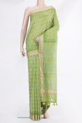 Green Chanderi Cotton Saree with Printed design on the body and Thread Border.  displayed on a mannequin