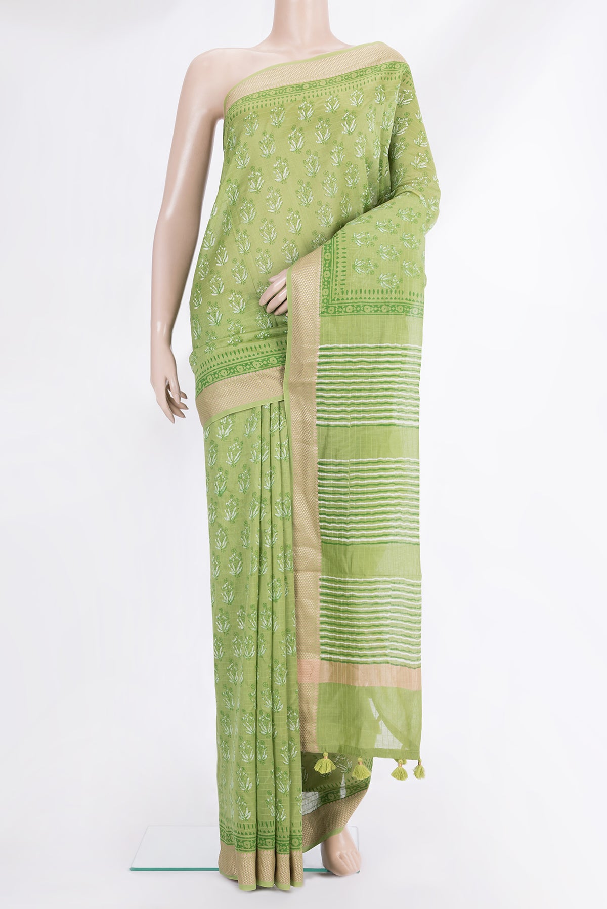 Green Chanderi Cotton Saree with Printed design on the body and Thread Border.  displayed on a mannequin