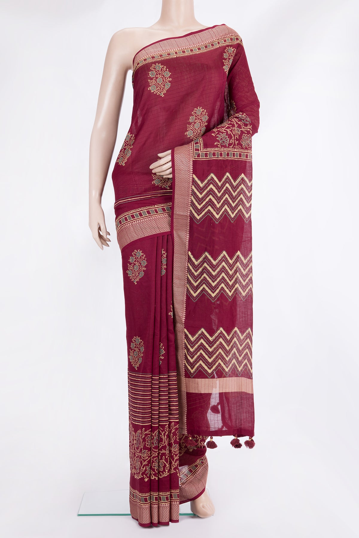 Maroon Chanderi Cotton Saree with Printed design on the body and Thread Border.  displayed on a mannequin