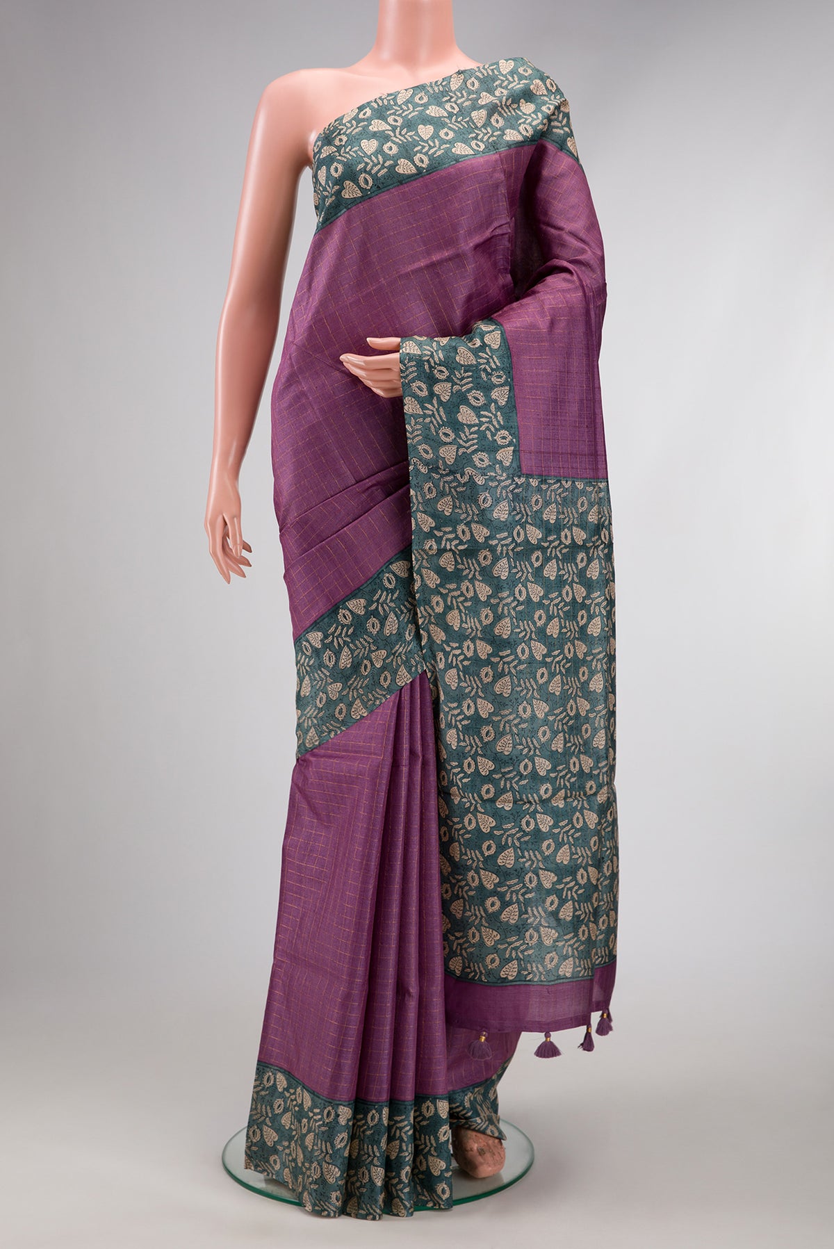 Lavender Dual Tone Tussar Silk Saree with Checked design on the body and Printed Border.  displayed on a mannequin