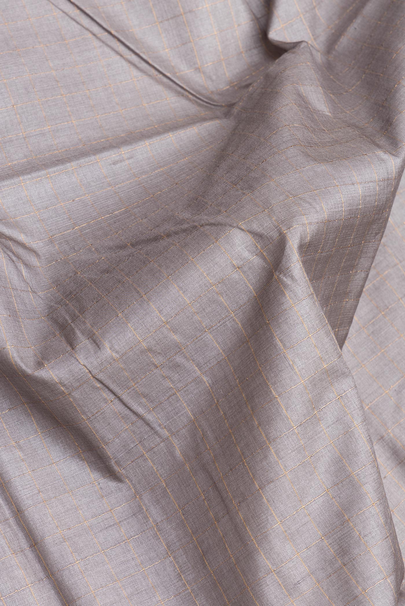 Close up of Grey Dual Tone Tussar Silk Saree with Checked design on the body and Printed Border.  displaying folds
