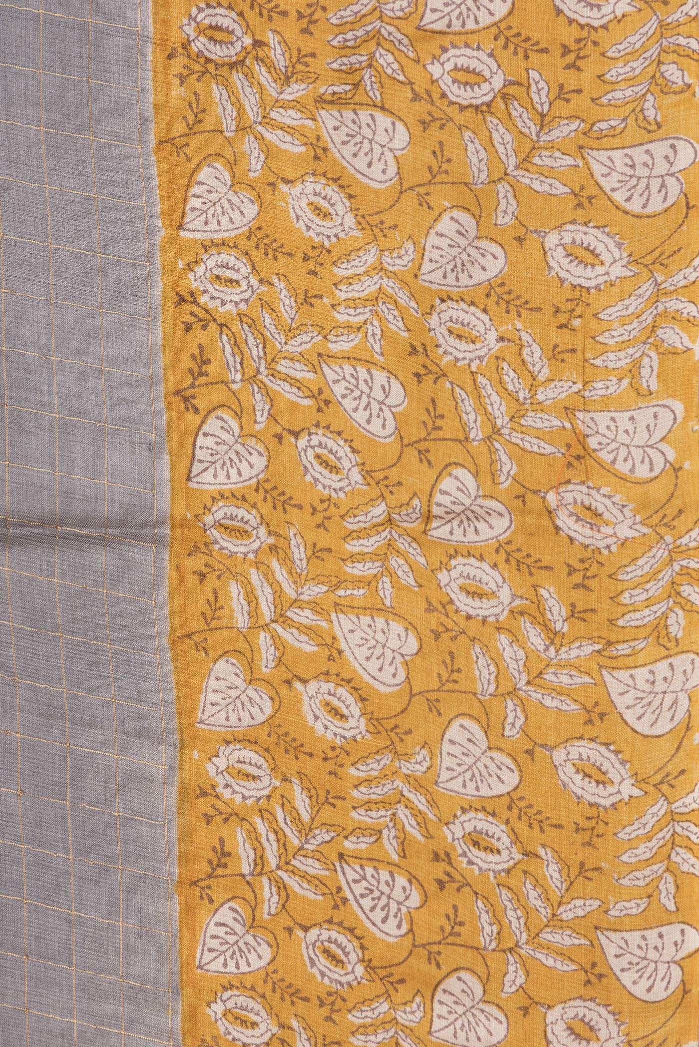 Border image of Grey Dual Tone Tussar Silk Saree with Checked design on the body and Printed Border. 