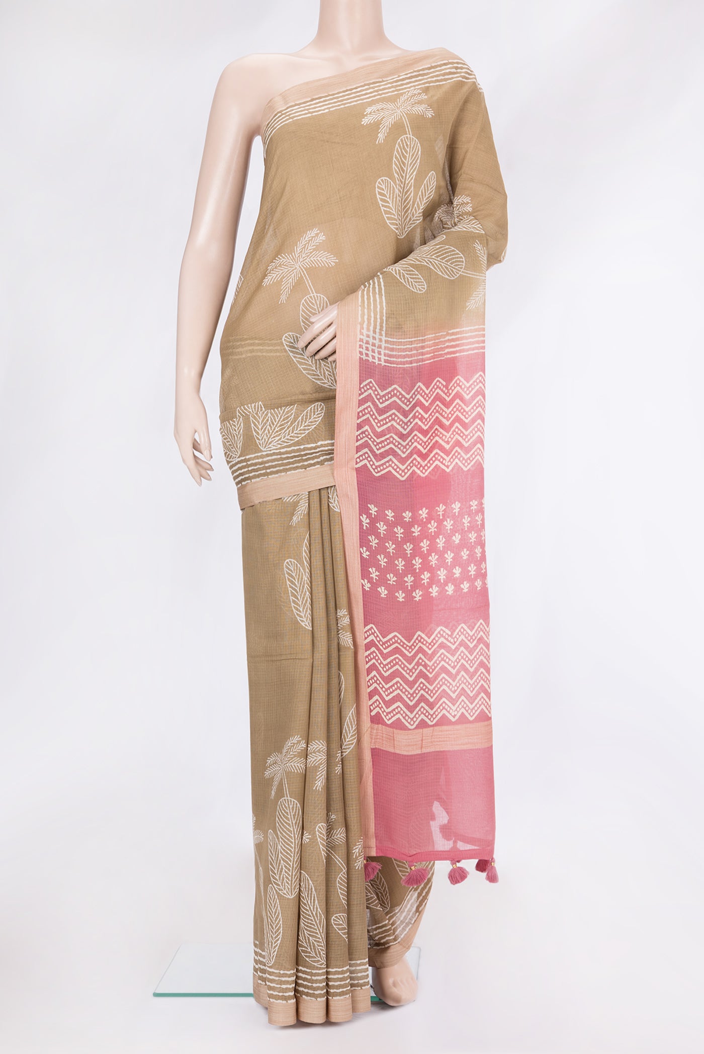 Beige Kota Cotton Saree with Printed design on the body and Printed Border.  displayed on a mannequin
