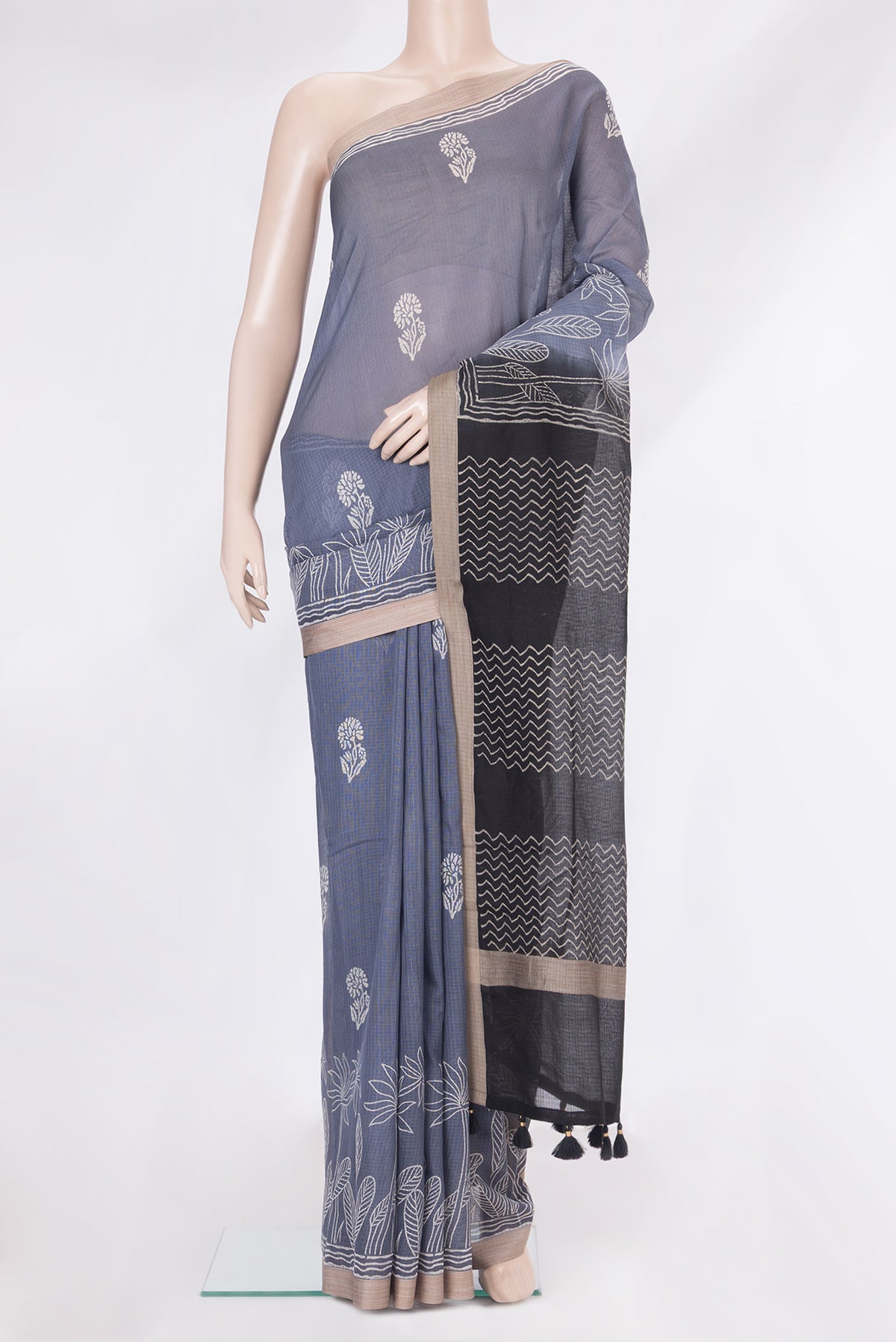 Grey Kota Silk Saree with Printed design on the body and Printed Border.  displayed on a mannequin