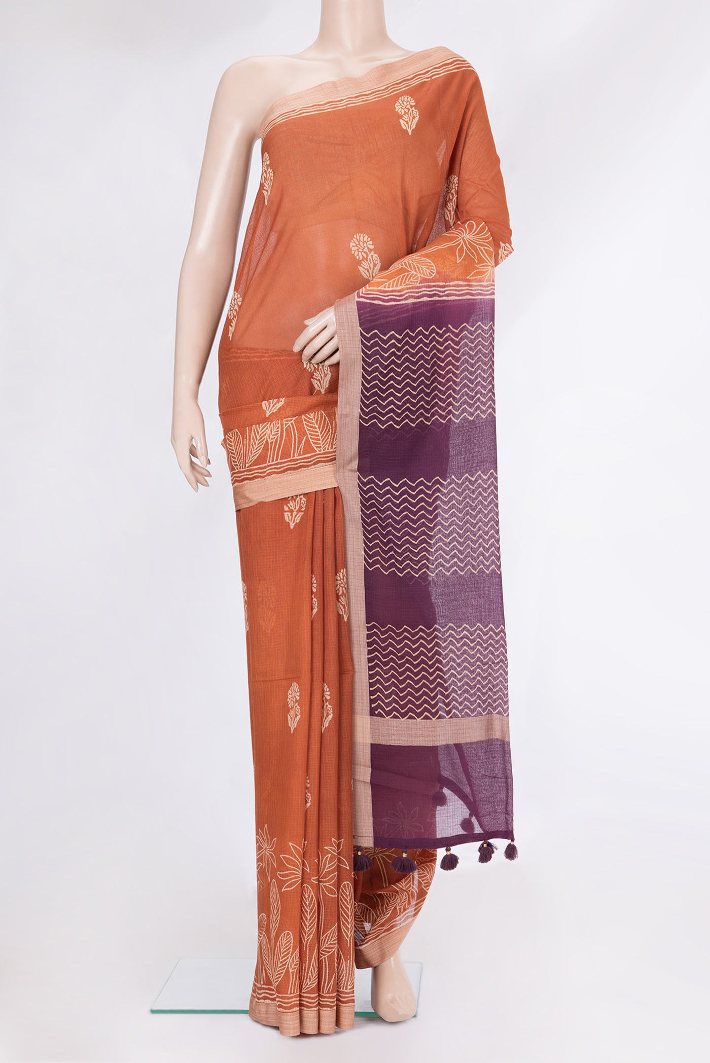 Brick Orange Kota Cotton Saree with Printed design on the body and Printed Border.  displayed on a mannequin