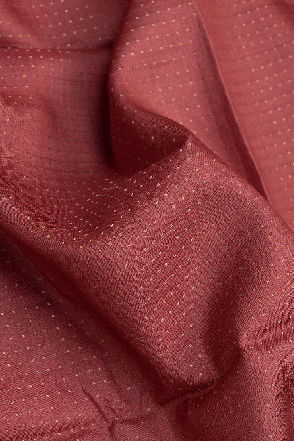 Close up of Maroon Dual Tone Tussar Silk Saree with Stripes on the body and Printed Border.  displaying folds