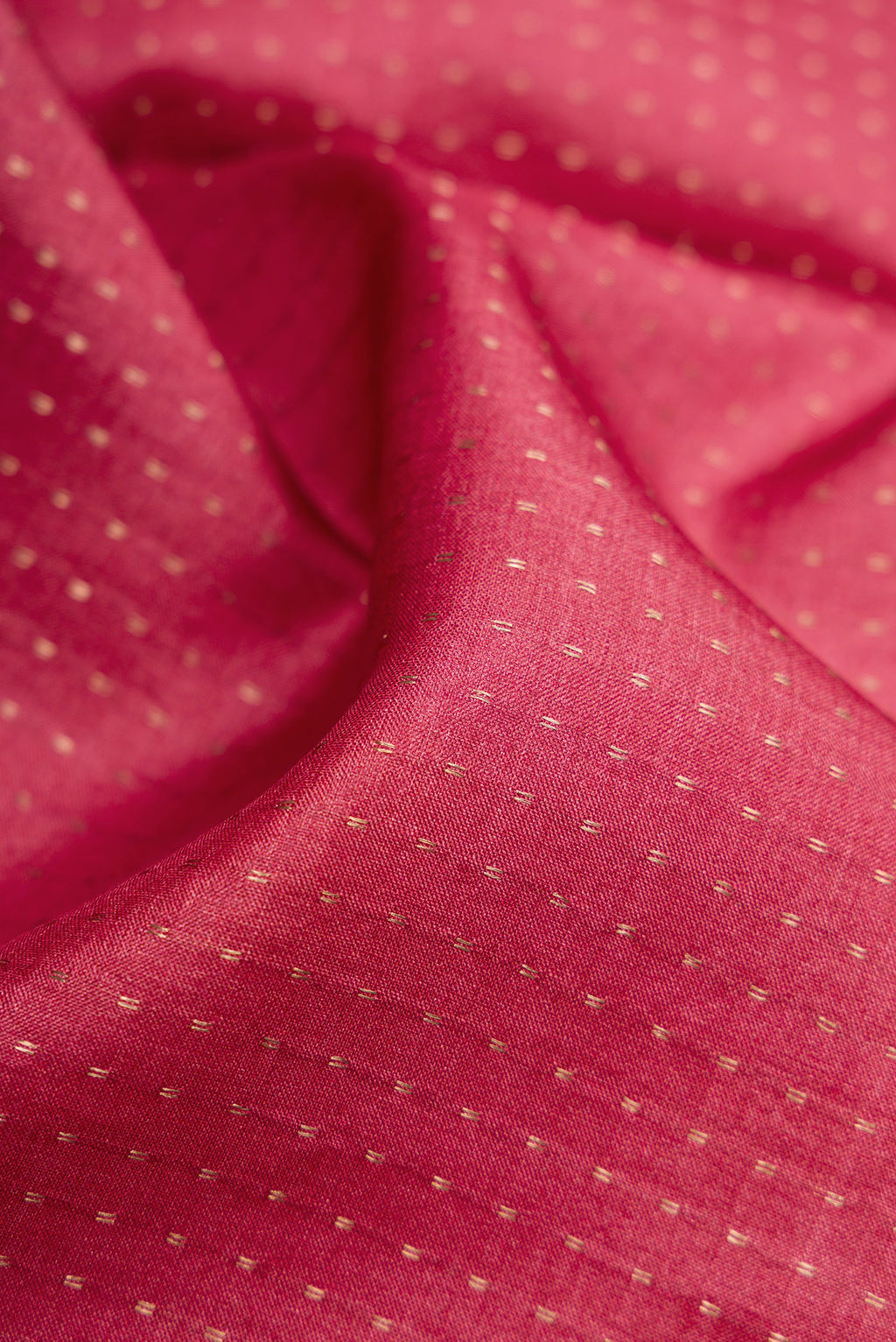Close up of Maroon Dual Tone Tussar Silk Saree with Stripes on the body and Printed Border.  displaying folds