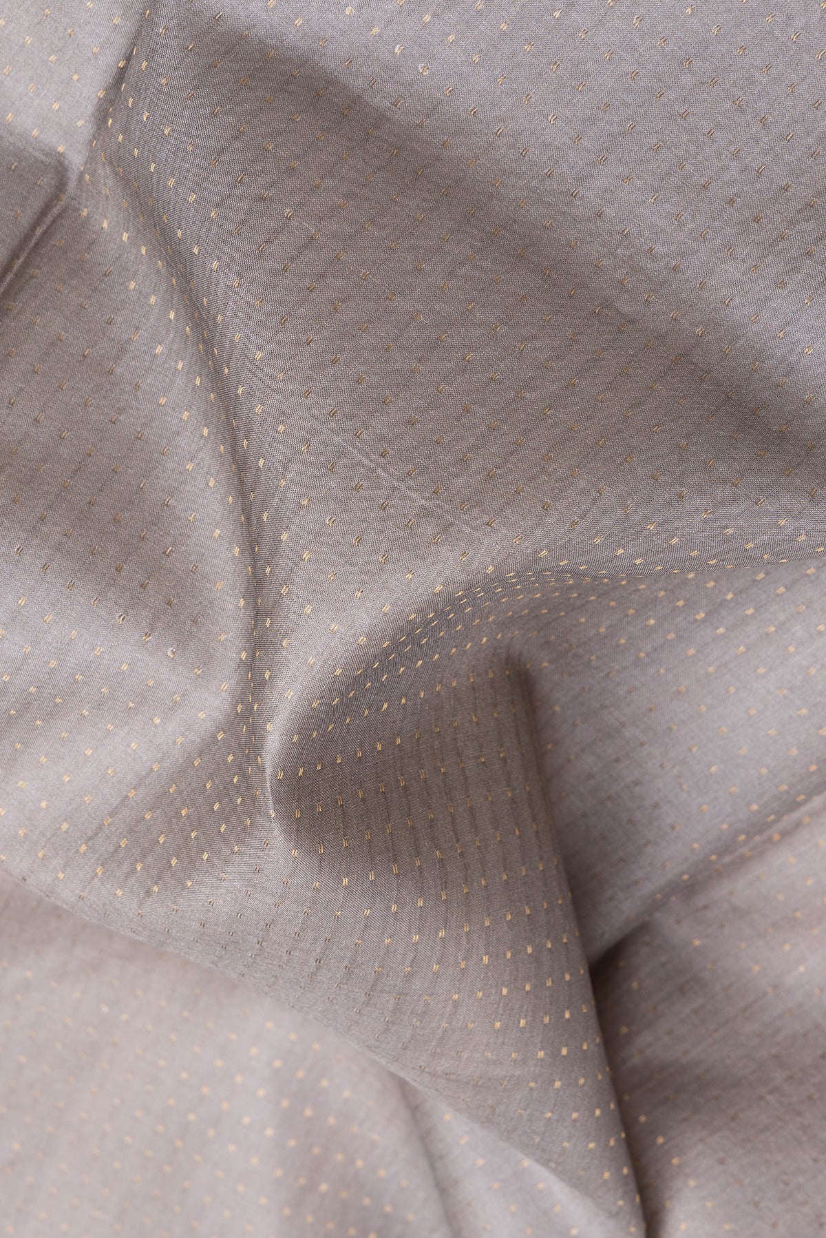 Close up of Grey Dual Tone Tussar Silk Saree with Stripes on the body and Printed Border.  displaying folds