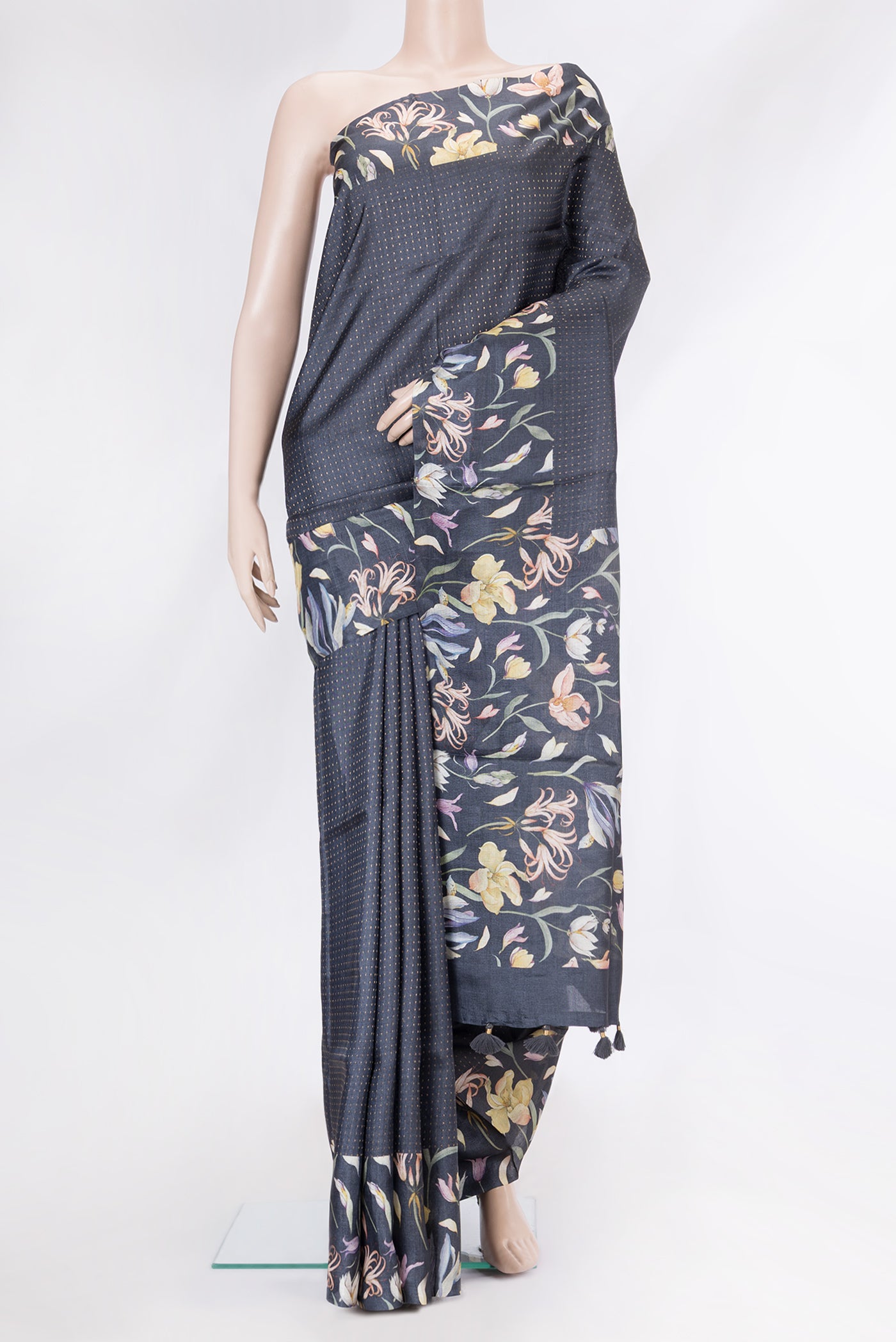 Black Tussar Silk Saree with Stripes on the body and Printed Border.  displayed on a mannequin