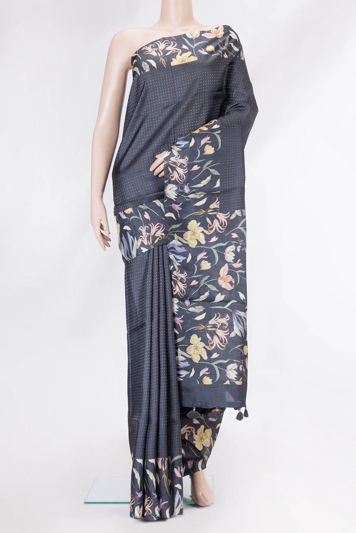 Black Tussar Silk Saree with Stripes on the body and Printed Border.  displayed on a mannequin