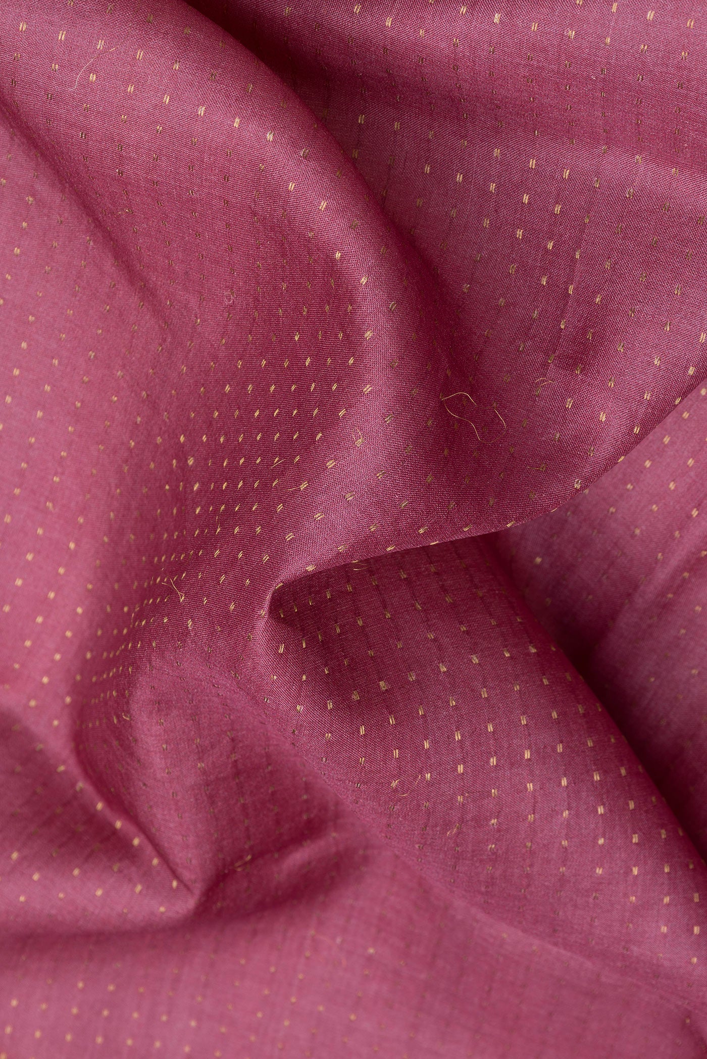 Close up of Pink Dual Tone Tussar Silk Saree with Stripes on the body and Fancy Border.  displaying folds