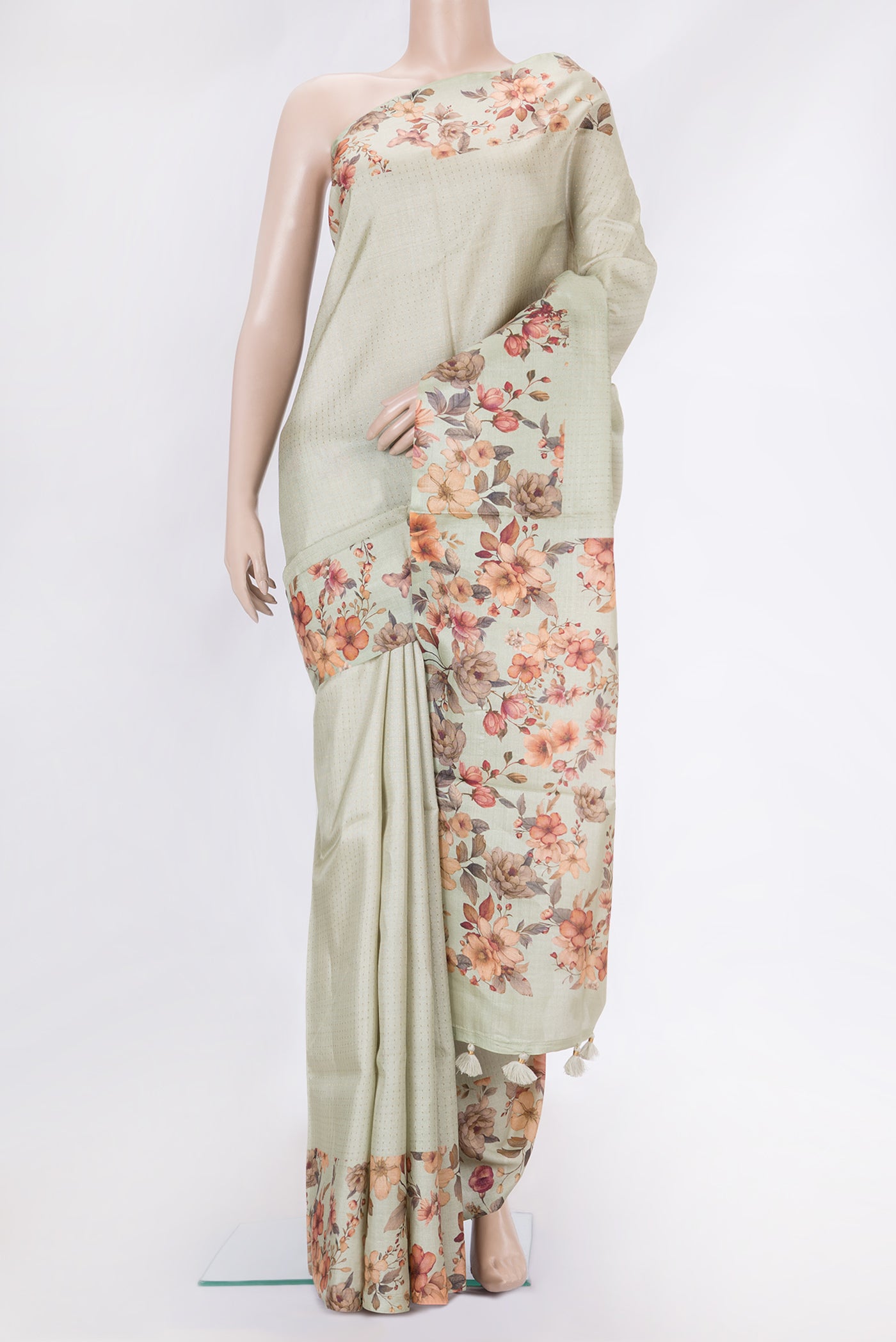 Pista Green Dual Tone Tussar Silk Saree with Stripes on the body and Printed Border.  displayed on a mannequin