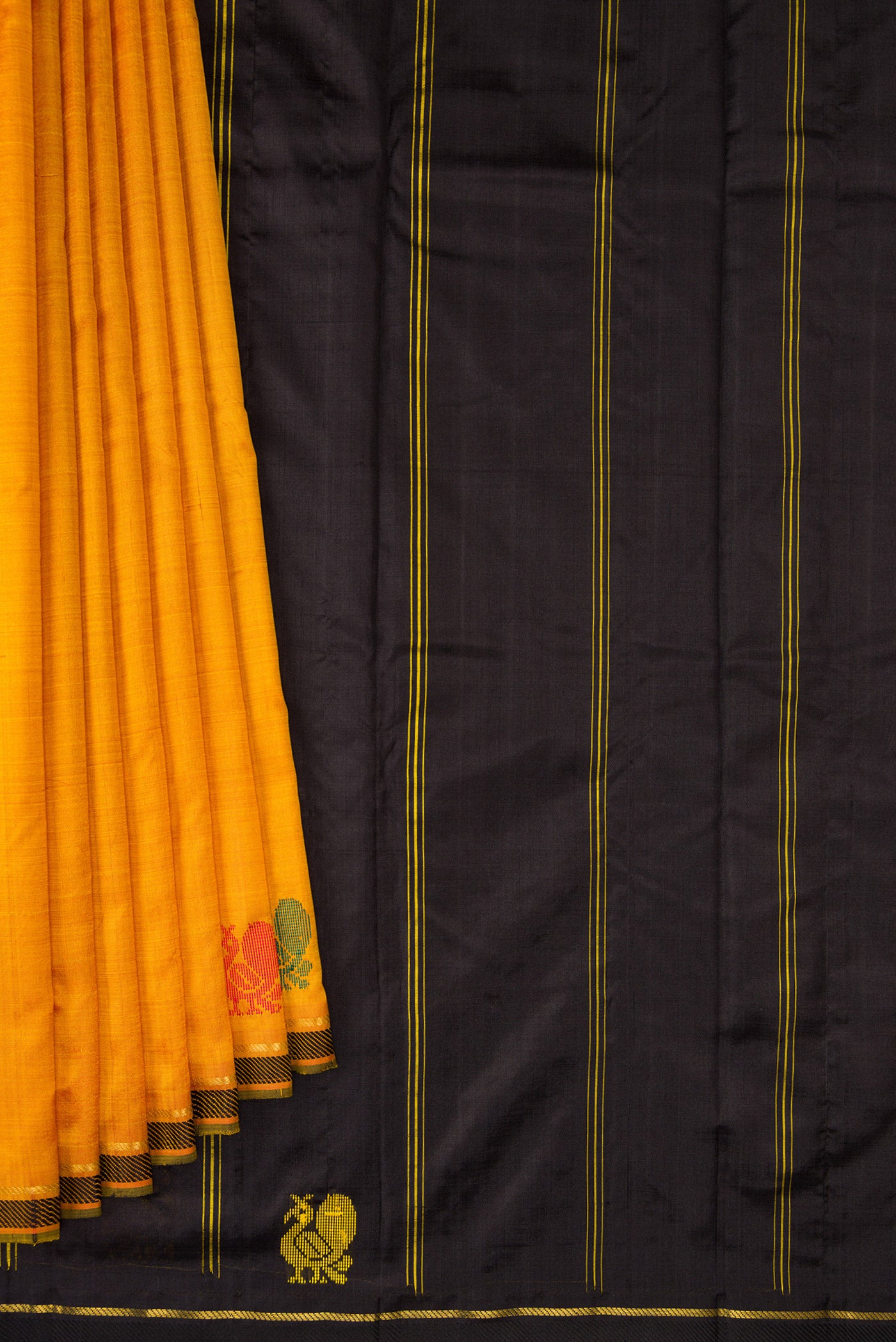 Pleats and pallu of Mustard Kanchipuram Silk Saree with Plain Body and Thread Border. 
