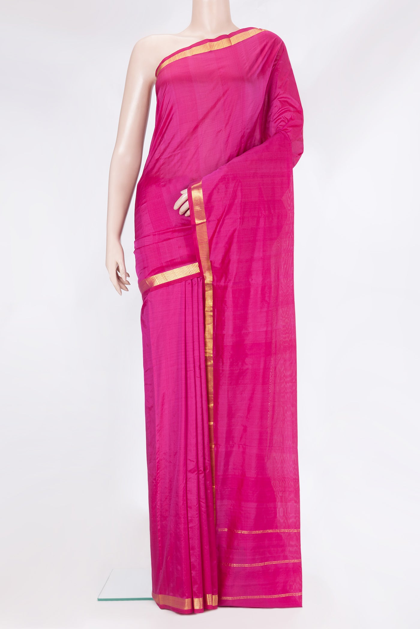 Magenta Kanchipuram Silk Saree with Plain Body and Zari Border.  displayed on a mannequin