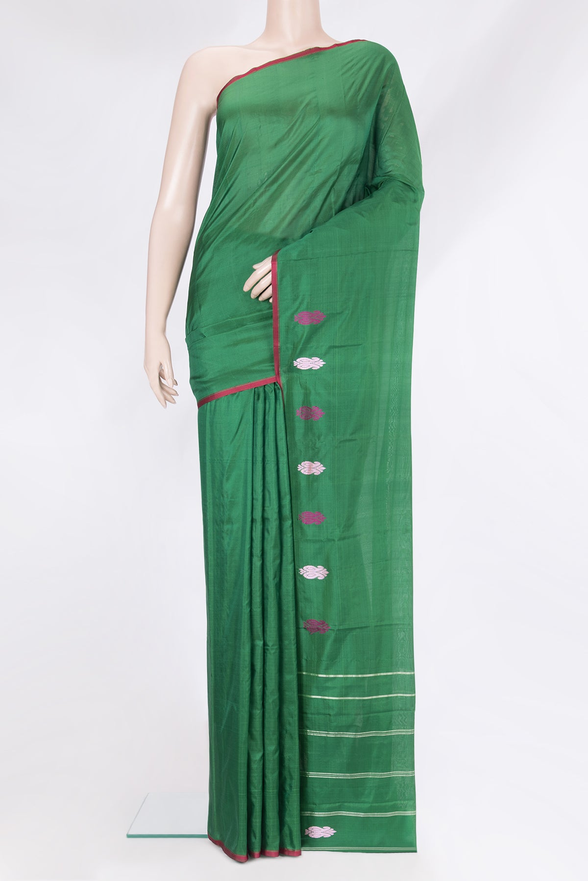 Bottle Green Kanchipuram Silk Saree with Plain Body and Thread Border.  displayed on a mannequin