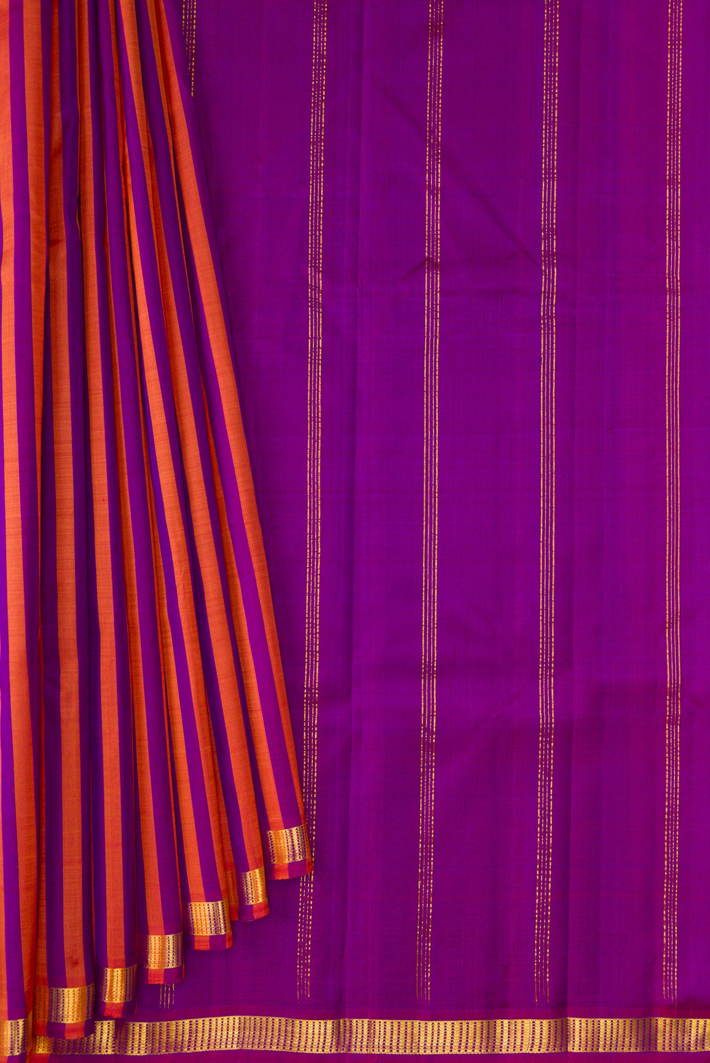 Pleats and pallu of Purple and Brick Orange Color Kanchipuram Silk Saree with Stripes on the body and Zari Border. 