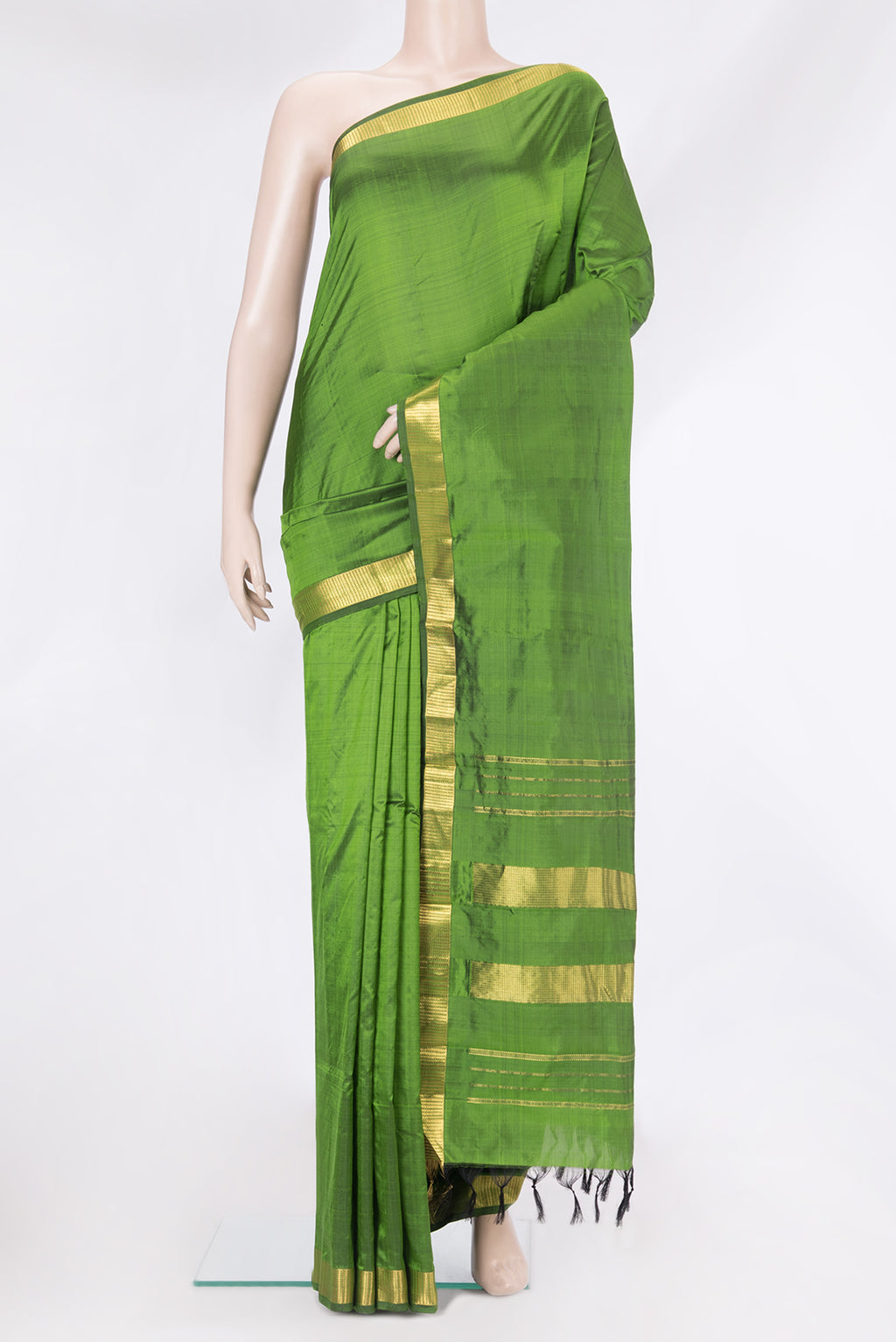 Mehandi Green Kanjivaram Silk Saree with Plain Body and Zari Border.  displayed on a mannequin