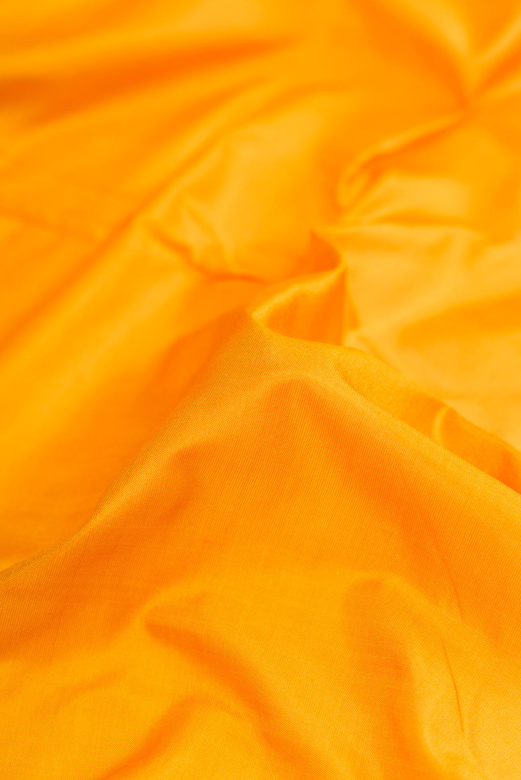 Close up of Yellow Dual Tone Kanchipuram Silk Nine Yards Saree with Thread Butta on the body and Thread Border.  displaying folds