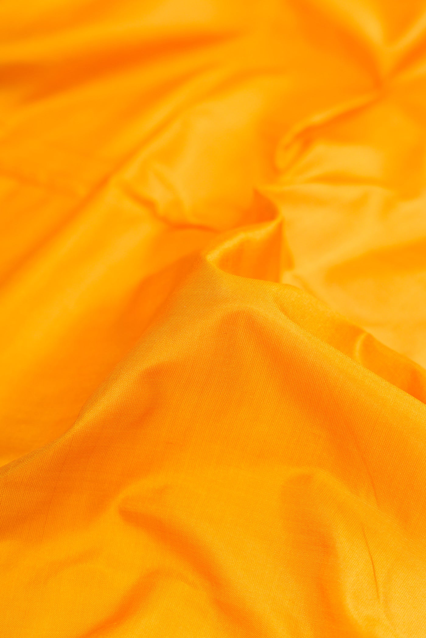 Close up of Yellow Dual Tone Kanchipuram Silk Nine Yards Saree with Thread Butta on the body and Thread Border.  displaying folds