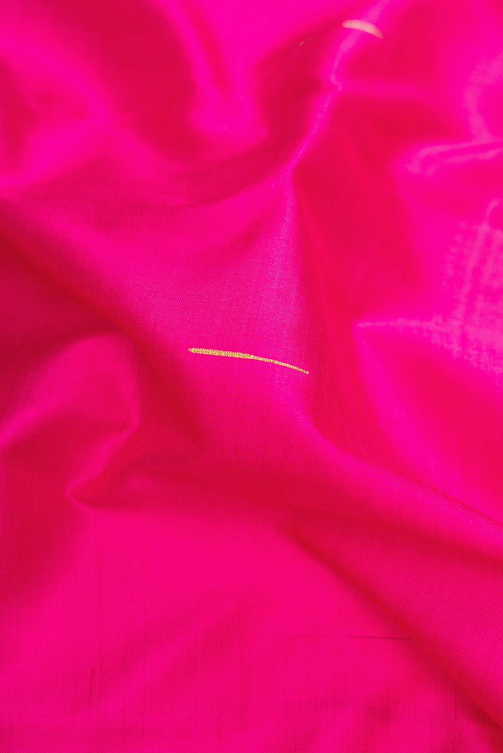 Close up of Pink Dual Tone Kanchipuram Silk Saree with Plain Body and Zari Border.  displaying folds