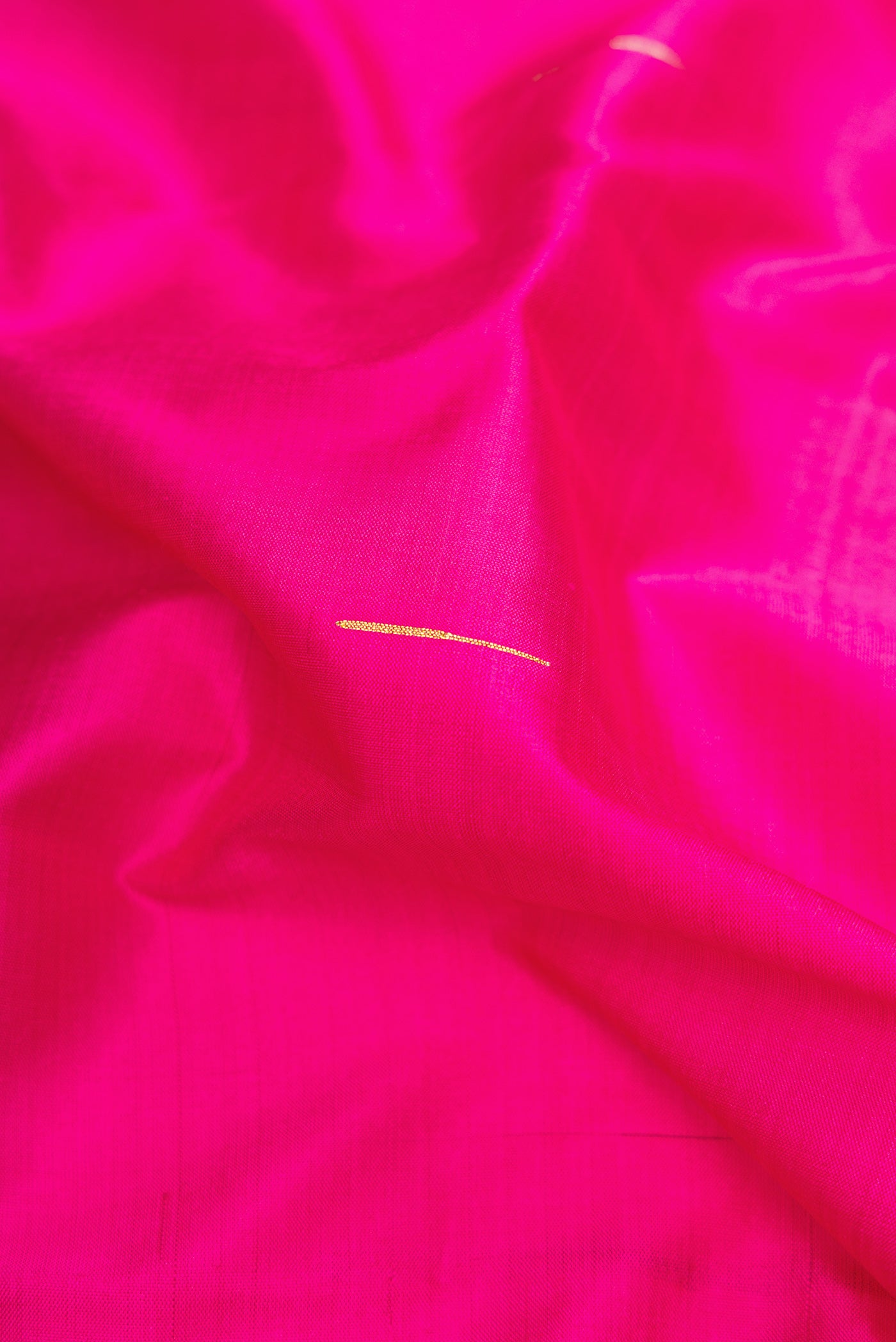 Close up of Pink Dual Tone Kanchipuram Silk Saree with Plain Body and Zari Border.  displaying folds