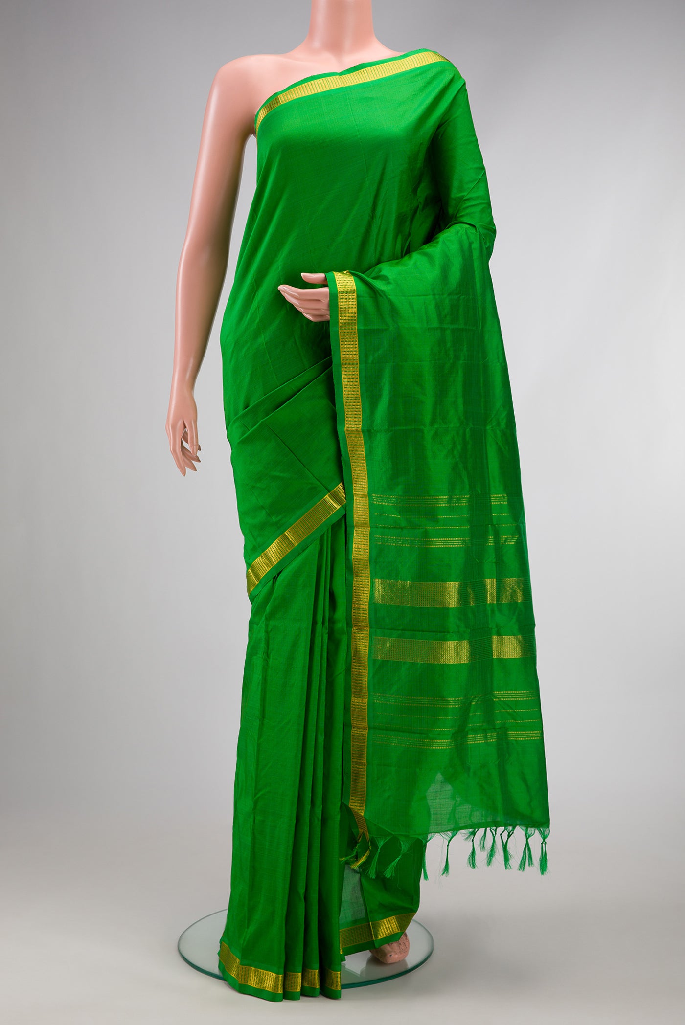 Green Dual Tone Kanjivaram Silk Saree with Plain Body and Zari Border.  displayed on a mannequin