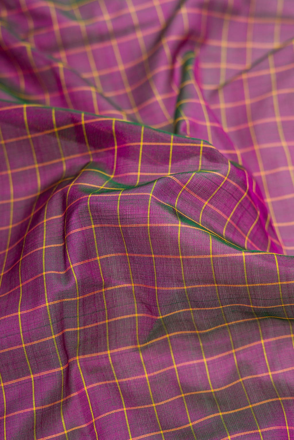 Close up of Purple Dual Tone Kanjivaram Silk Nine Yards Saree with Checked design on the body and Zari Border.  displaying folds