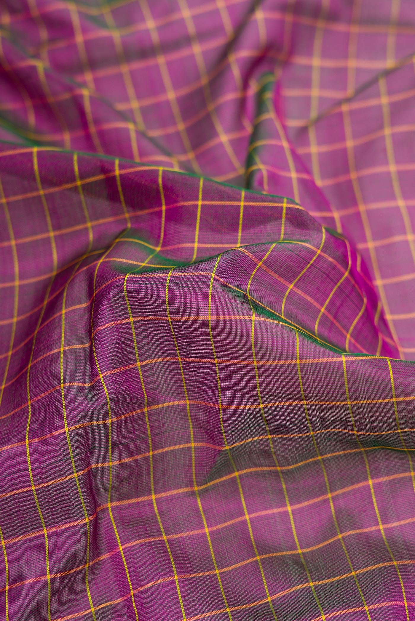 Close up of Purple Dual Tone Kanjivaram Silk Nine Yards Saree with Checked design on the body and Zari Border.  displaying folds