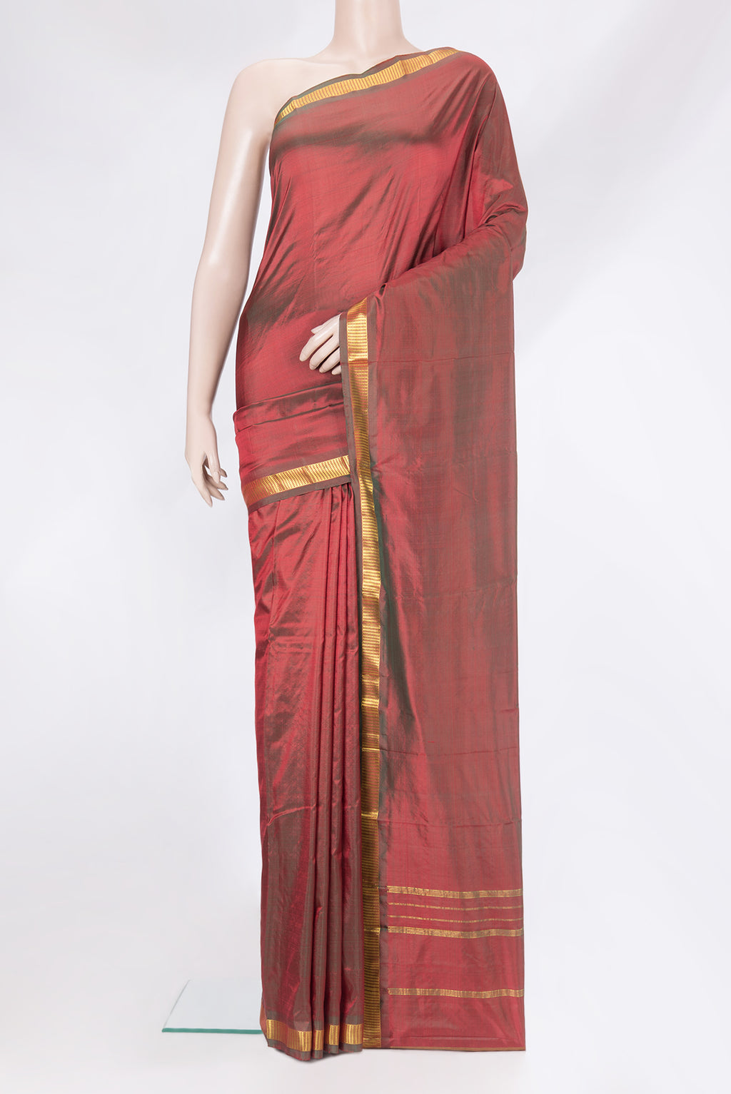 Maroon Kanchipuram Silk Saree with Plain Body and Zari Border.  displayed on a mannequin
