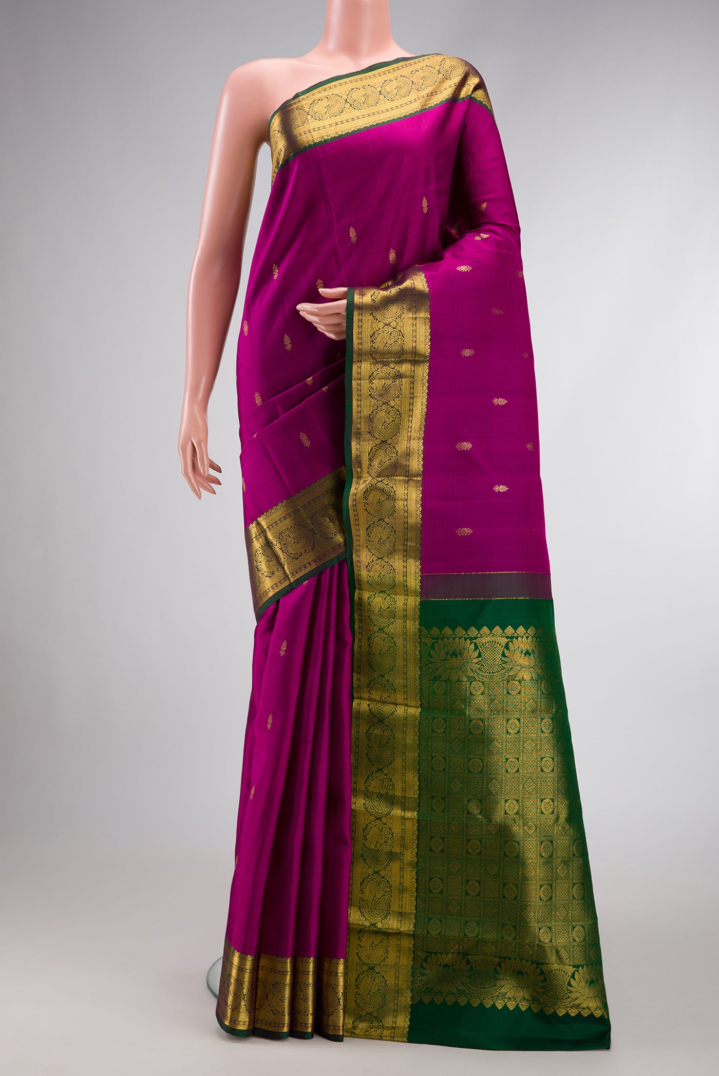 Magenta Dual Tone Kanjivaram Silk Saree with Zari Butta on the body and Zari Border.  displayed on a mannequin
