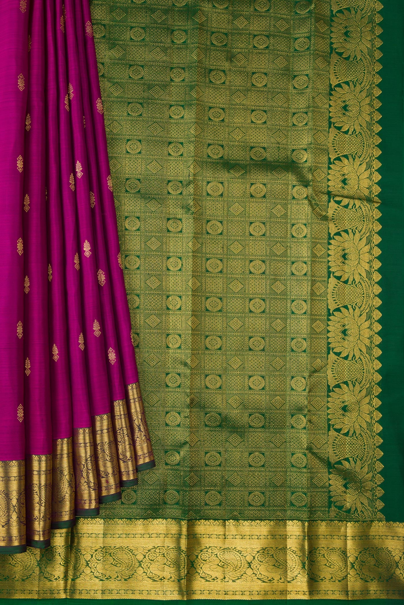 Pleats and pallu of Magenta Dual Tone Kanjivaram Silk Saree with Zari Butta on the body and Zari Border. 