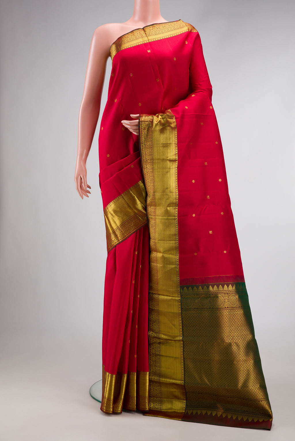 Red Dual Tone Kanjivaram Silk Saree with Zari Butta on the body and Zari Border.  displayed on a mannequin
