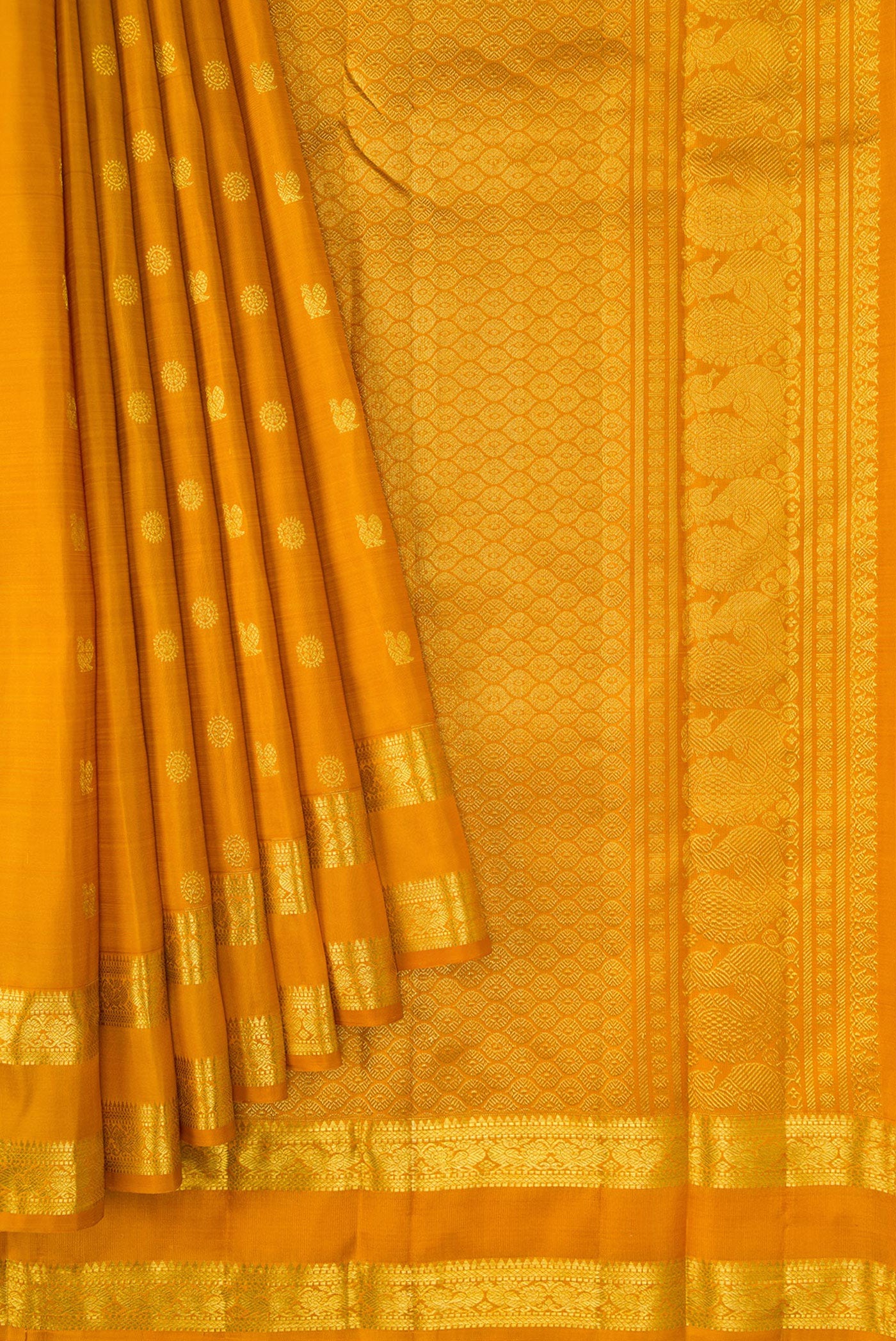 Pleats and pallu of Mustard Dual Tone Kanjivaram Silk Saree with Zari Butta on the body and Zari Border. 