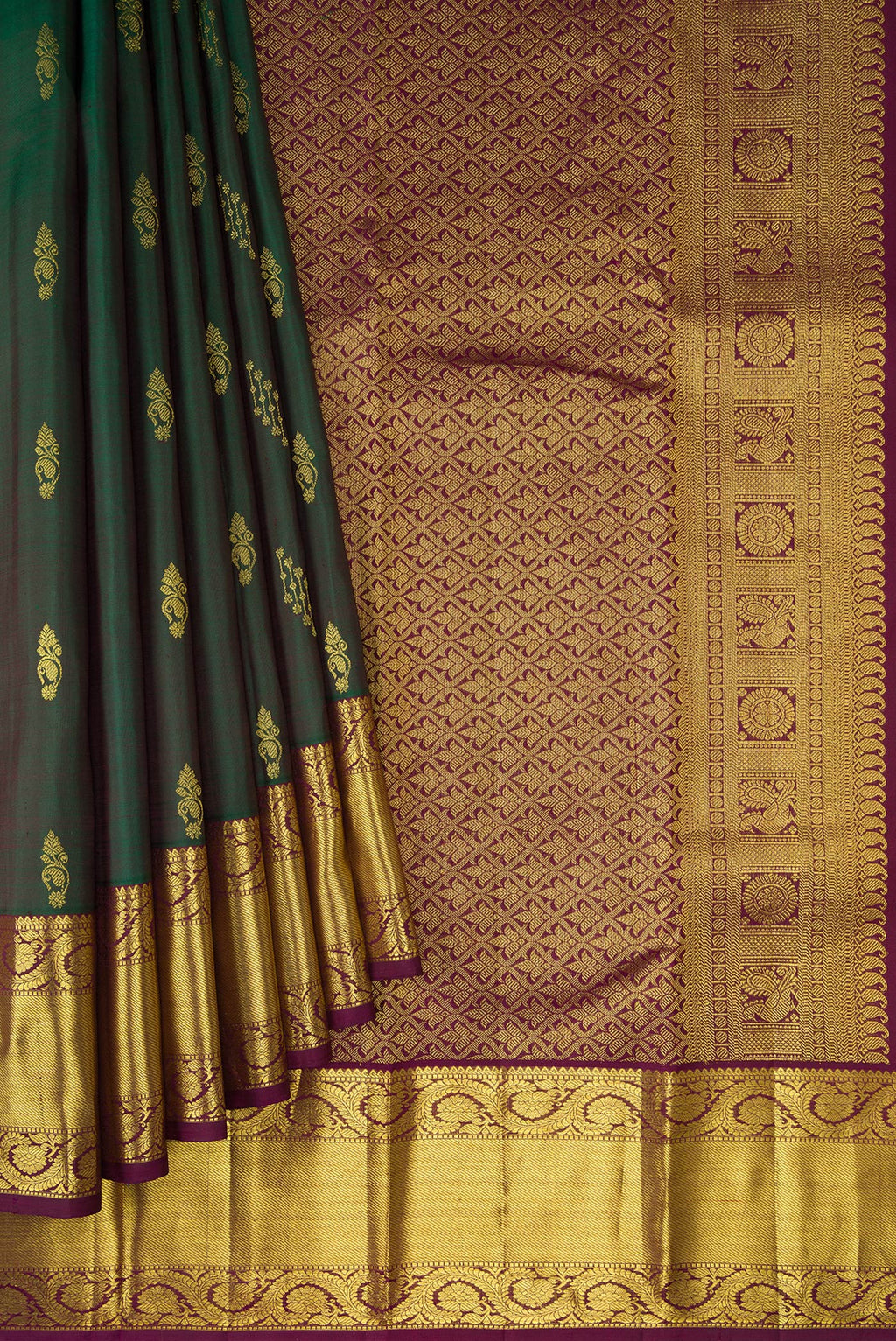 Pleats and pallu of Bottle Green Dual Tone Kanjivaram Silk Saree with Zari Butta on the body and Zari Border. 